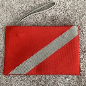 Rothy’s wristlet in poppy